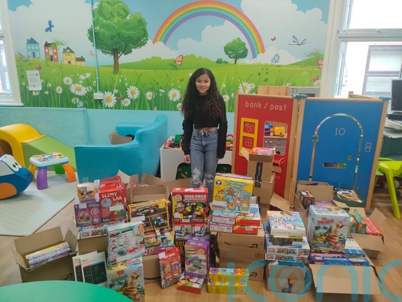 Cancer survivor takes toys to children on hospital ward that cared for her