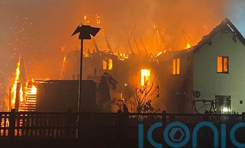 Dogs alert owners to huge house fire by barking in early hours