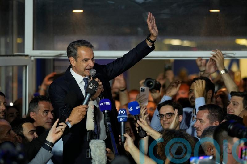 Greek prime minister to seek outright majority after huge election lead