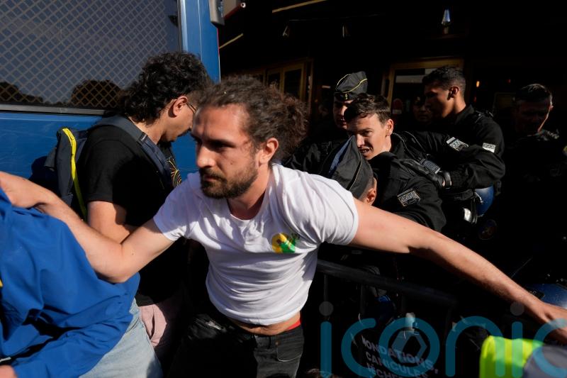 Climate protesters face tear gas at TotalEnergies shareholder meeting in Paris