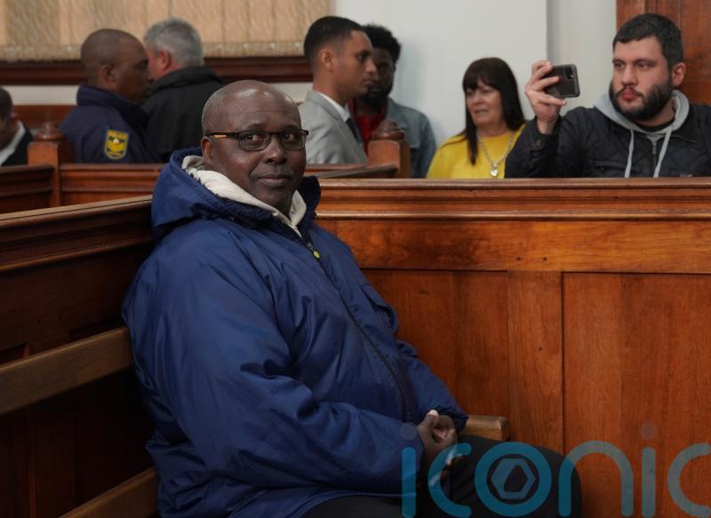 Rwandan genocide suspect appears in court holding Bible after 22 years on run