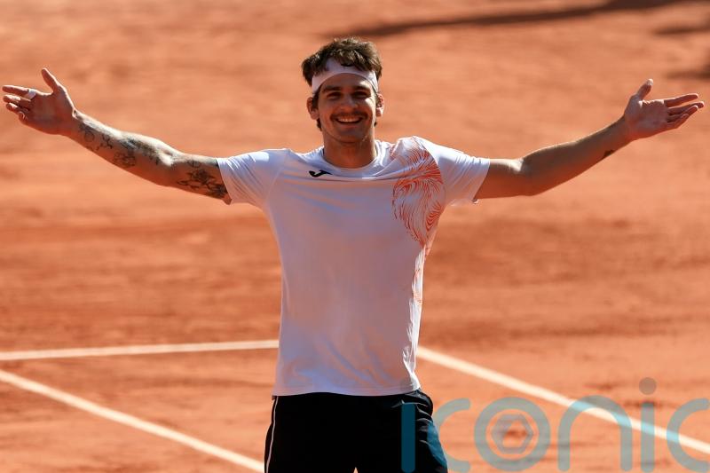 French Open day three: Seyboth Wild springs shock as Swiatek powers through