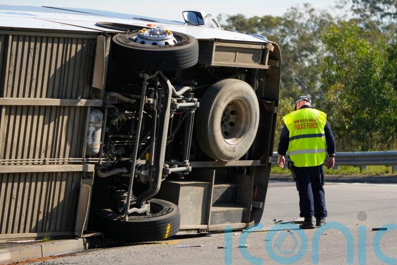 Driver charged after bus carrying wedding guests rolls over, killing 10
