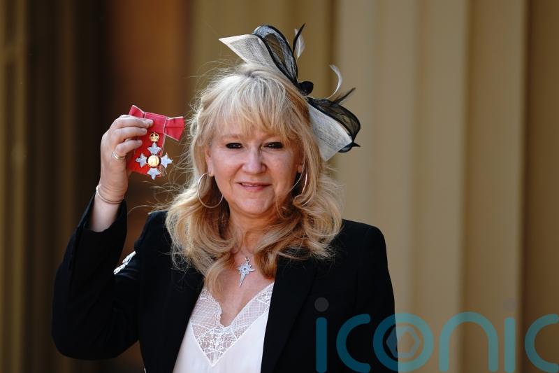 Top theatre producer picks up gong ‘in the memory of her family’