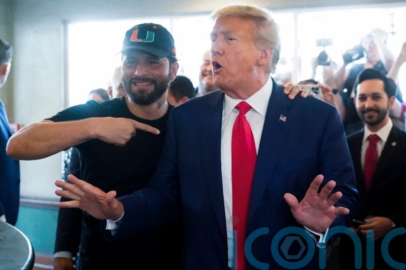 Donald Trump mixes roles as defendant and campaigner after historic charge