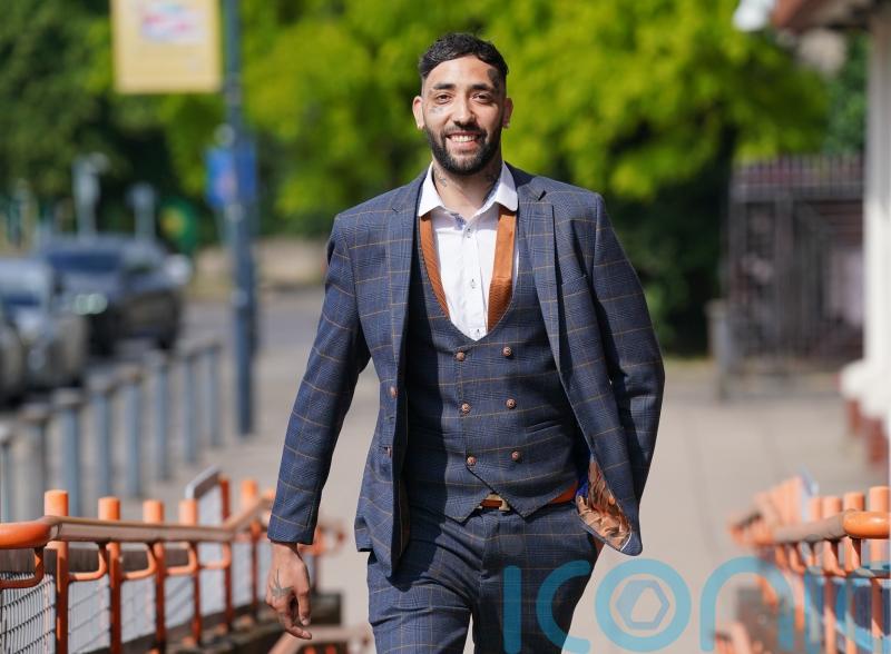 Man chuckles in court after receiving football ban for wearing offensive shirt