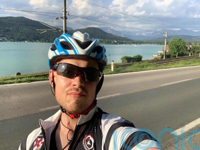 Man with muscle-wasting condition completes gruelling Ironman triathlon