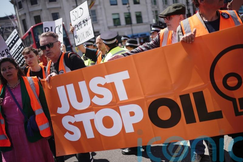 Water thrown onto slow marching Just Stop Oil protesters