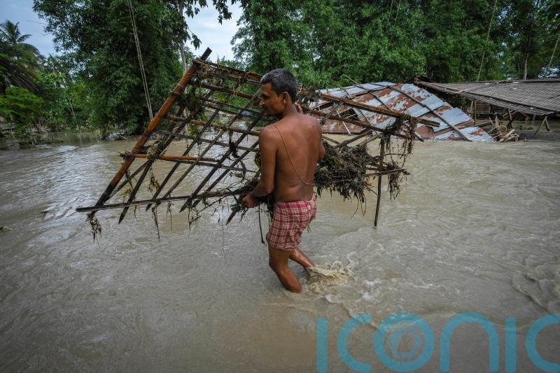 Flooding displaces tens of thousands as monsoon rains batter Indian villages