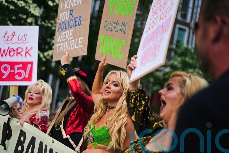 Celebrity impersonators banned from Facebook protest outside Meta offices