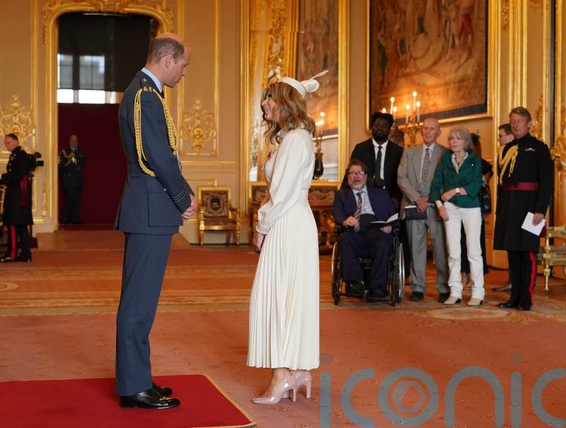 Derek Draper watches as wife Kate Garraway collects MBE from William