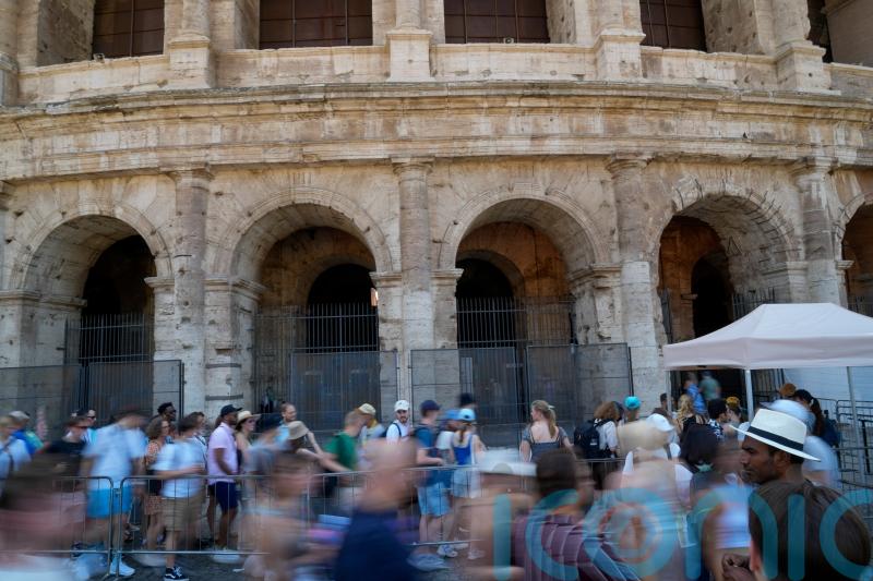Man filmed carving name on Colosseum is tourist living in Britain, police say