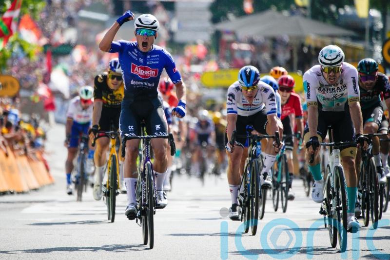Jasper Philipsen sprints to stage three win as Adam Yates remains in yellow