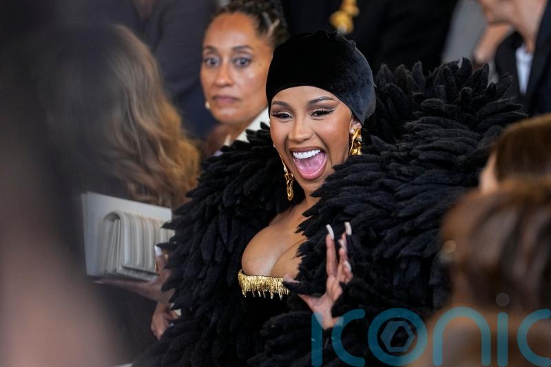 Cardi B dons dramatic feather-like bolero at Paris Fashion Week