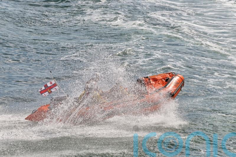 Teenagers cut off by tide rescued