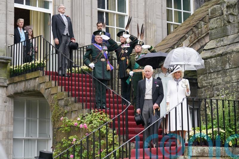 Rain hailed as ‘next year’s whisky’ as 8,000 attend royal garden party