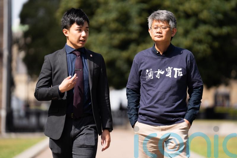 Hong Kong activists with arrest warrants demand meeting with Cleverly