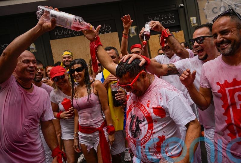 Thousands party in Pamplona as firework blast begins bull-running festival