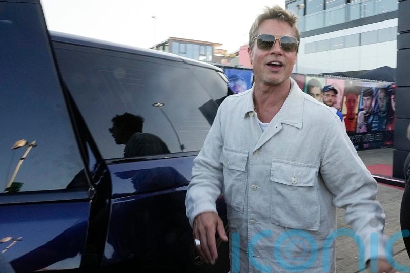 Brad Pitt cheers fans at Silverstone paddock ahead of British Grand Prix