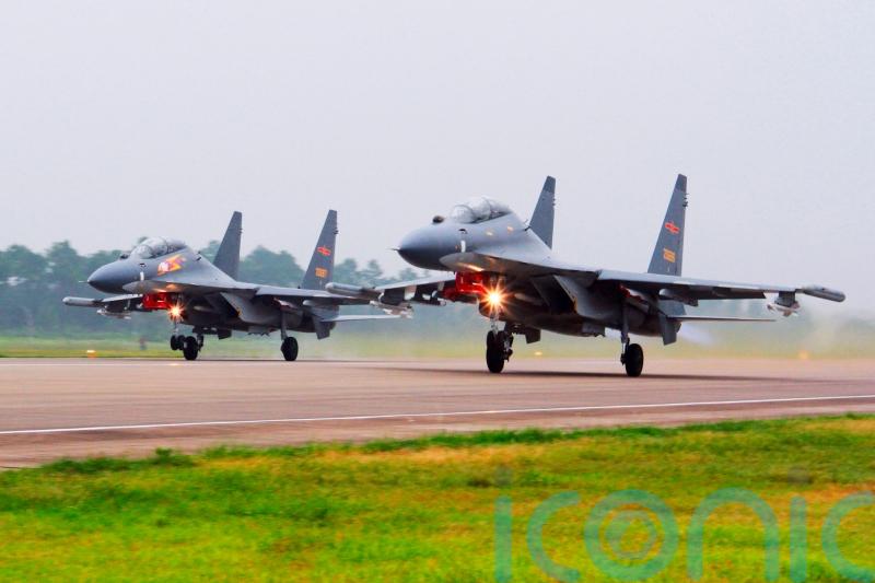 China sends warplanes and navy ships towards Taiwan in show of force