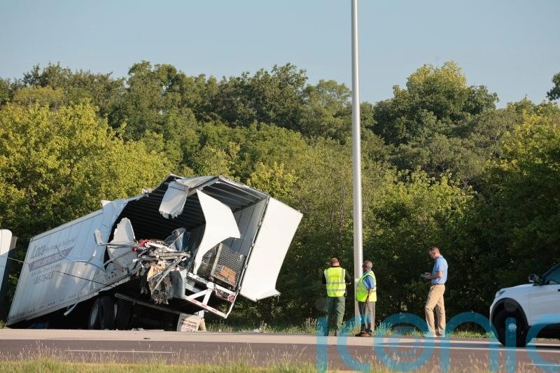 Three killed as Greyhound bus crashes into parked lorries in Illinois