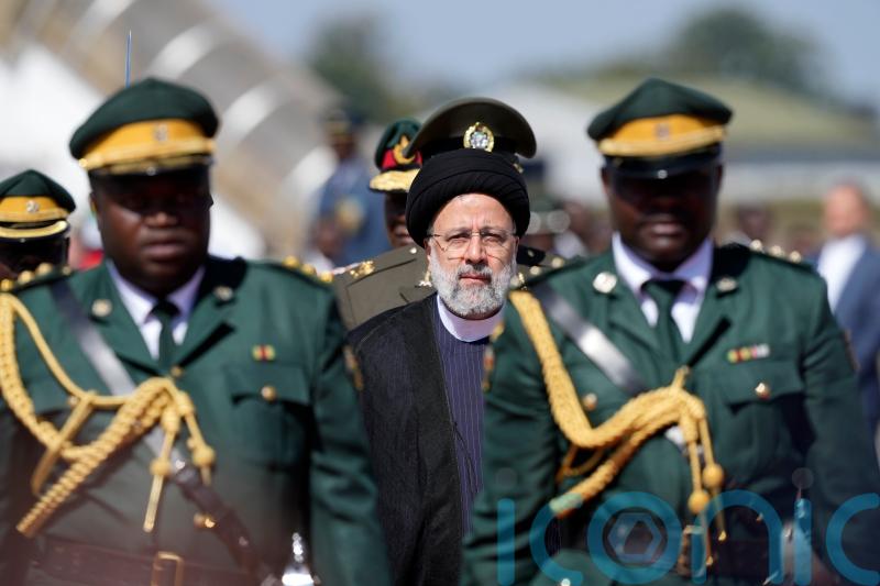 Iranian president welcomed in Zimbabwe with anti-West songs