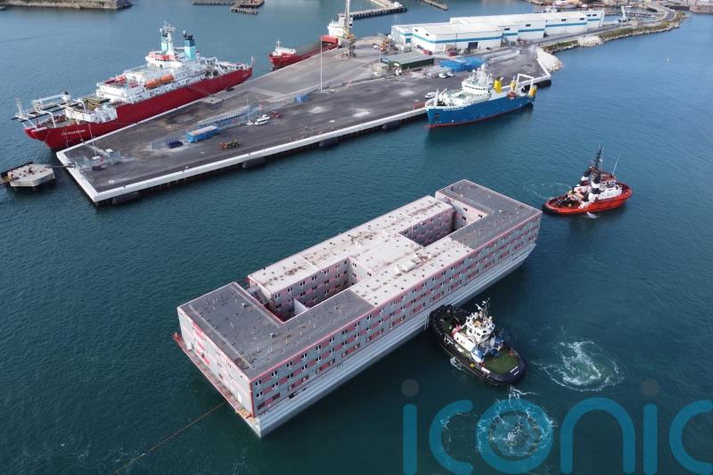Bibby Stockholm met by protesters as it arrives into Portland Port