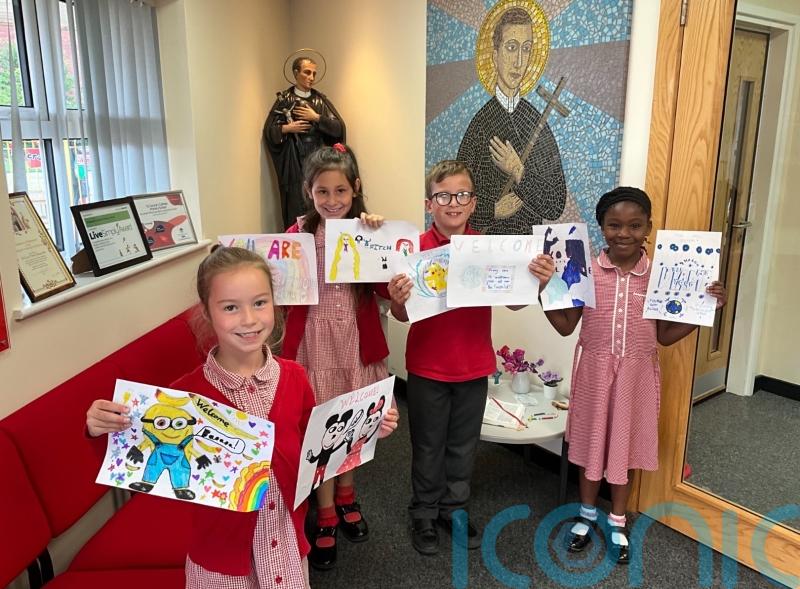 Primary school children take action after murals at refugee centre painted over