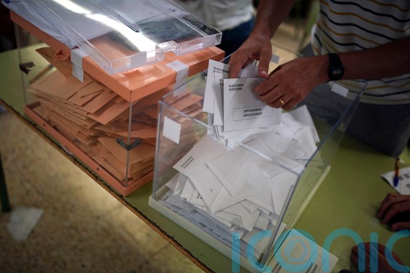 Spain’s Socialists and conservative challengers neck-and-neck in election count