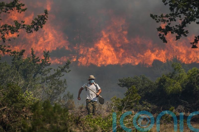 Night-time evacuations take place on Greek islands as wildfires rage