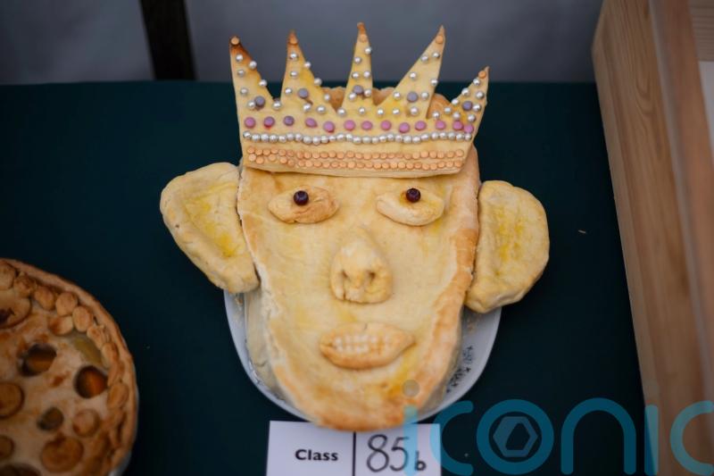 That looks very much like my husband, says Queen as King is depicted in pie form