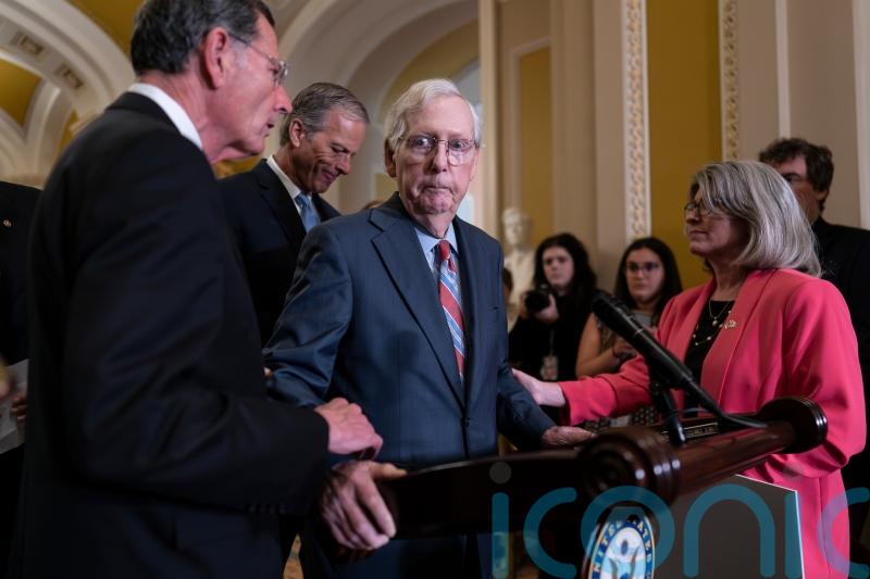 Mitch McConnell helped away from cameras after freezing during press conference