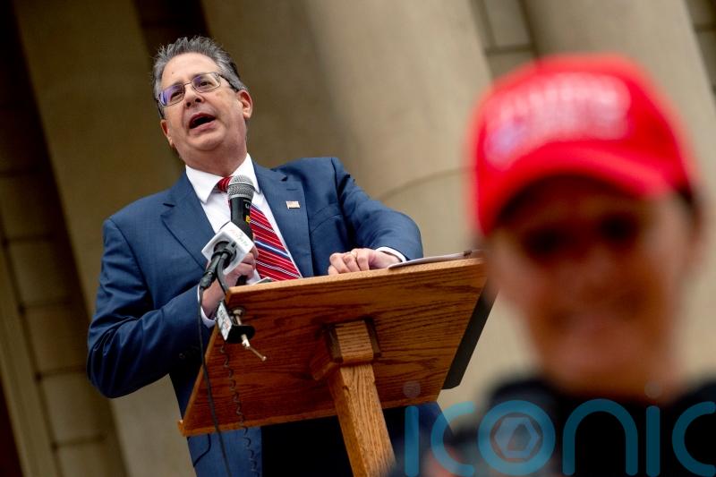 Michigan prosecutors charge Trump allies with vote machine tampering