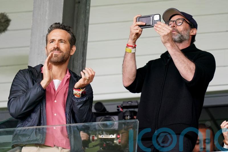 Hugh Jackman watches Wrexham game with Ryan Reynolds and Rob McElhenney