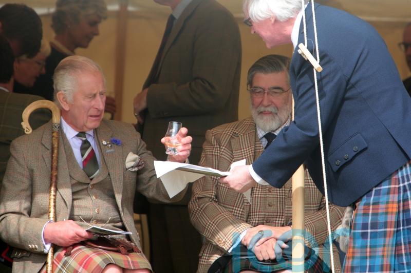 King enjoys wee dram at Highland Games