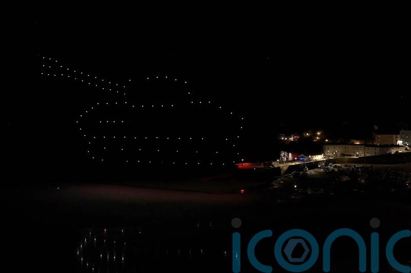 Drone display held over coastal town to highlight military training land risks