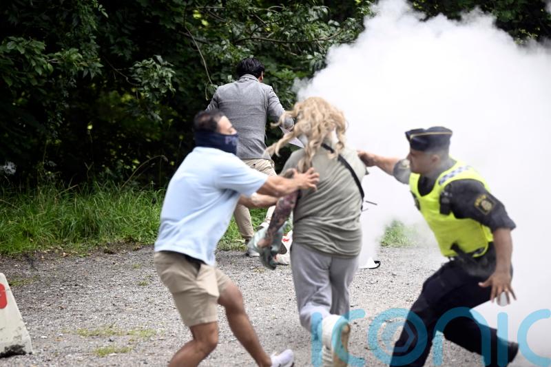 Woman sprays Koran-burning protester in Sweden with fire extinguisher