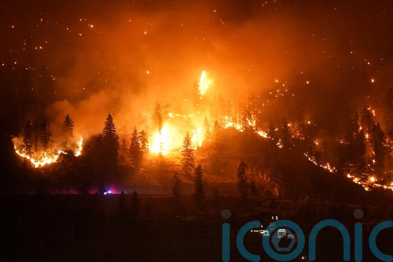 Canadian firefighters wage battle to save communities after mass evacuations