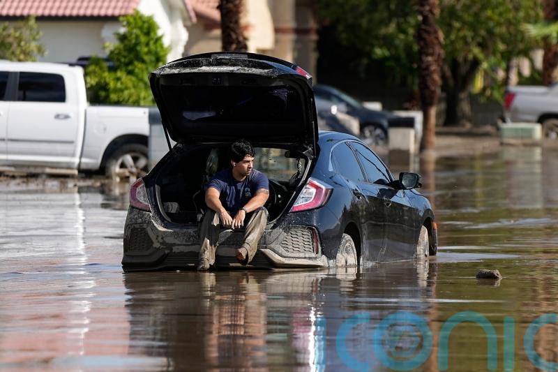 California towns dig out of the mud from first tropical storm in 84 years