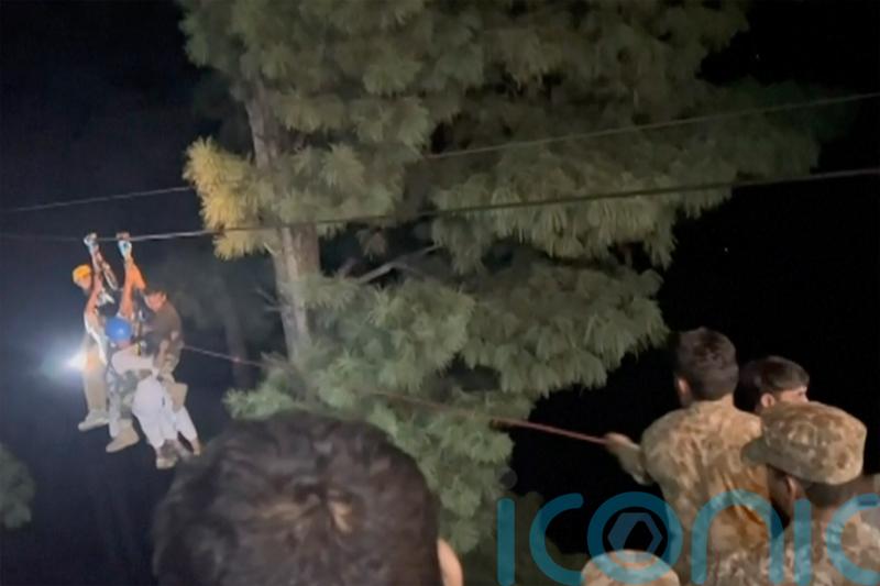 Rescuers save eight people trapped in cable car above canyon in Pakistan