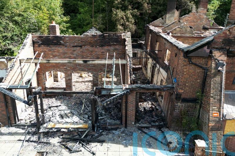 Two men arrested after fire at Crooked House pub released on police bail