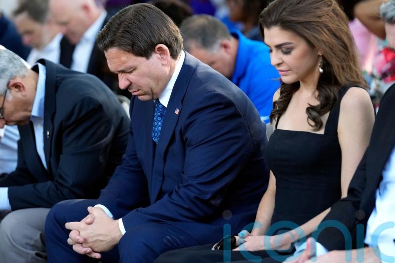 Florida governor Ron DeSantis booed at vigil as hundreds mourn racist killings