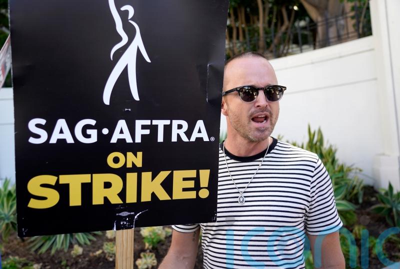 Aaron Paul says higher-ups at Hollywood studios need to ‘come back to reality’