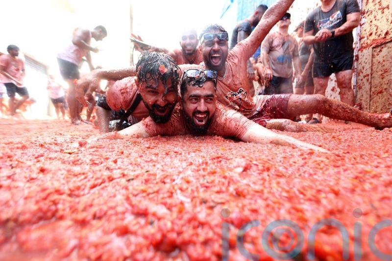 Revellers hurl tomatoes at each other in Spanish town’s Tomatina party