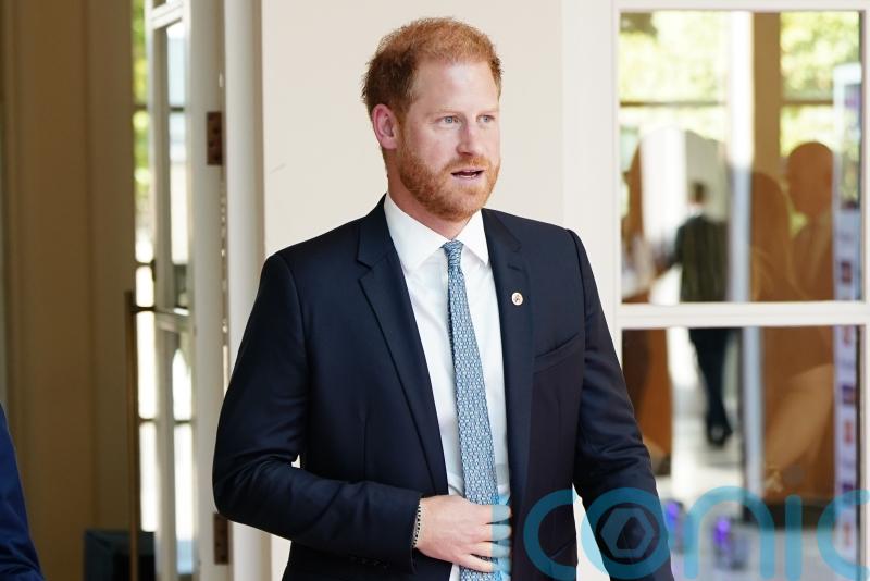 Harry all smiles on arrival at WellChild Awards