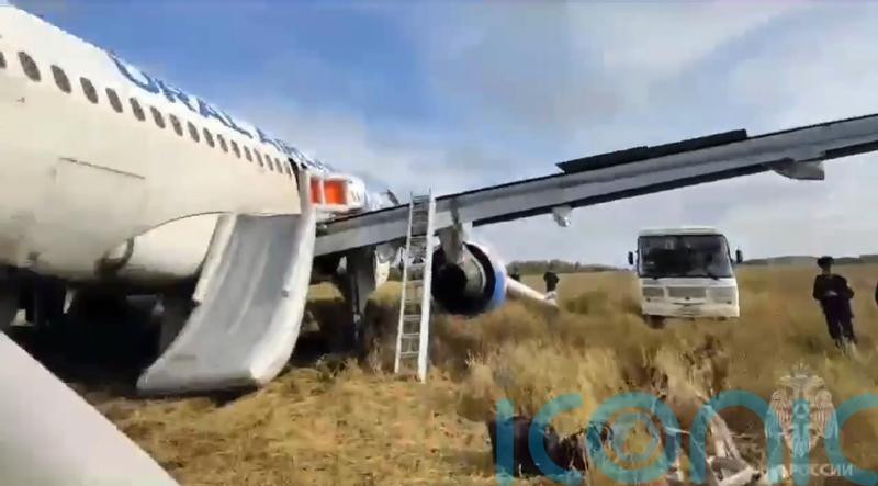 Russian passenger plane with hydraulics problem makes emergency landing in field