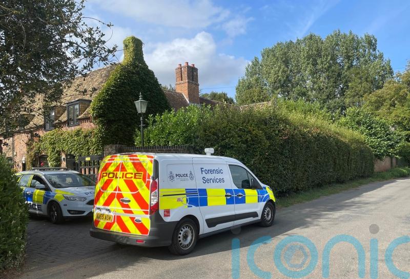 Man held on suspicion of murder after woman, 65, shot dead