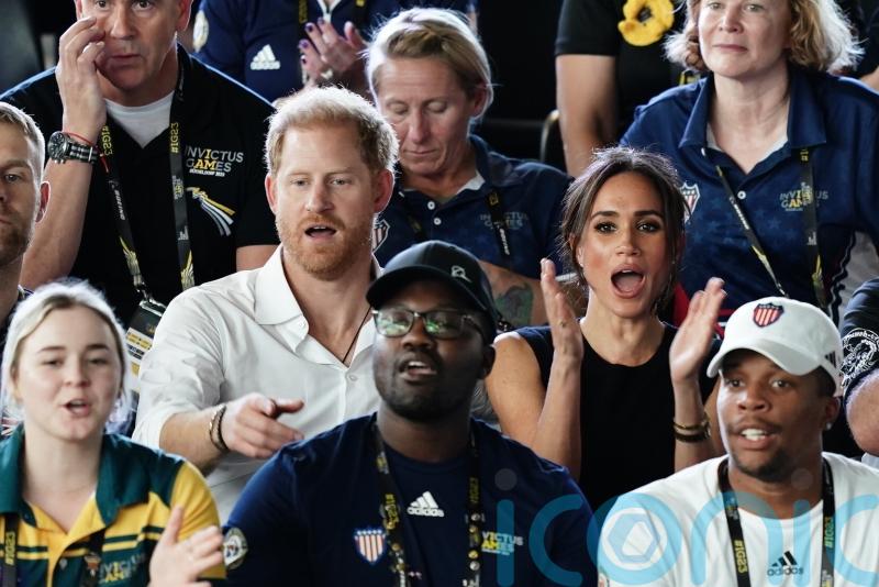 Meghan and Harry join crowds at Invictus Games after walking in holding hands