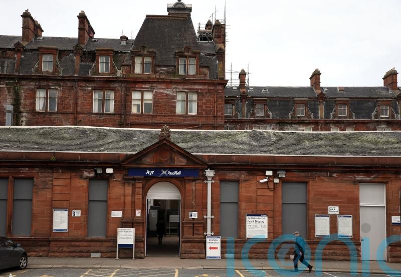 Two teenagers charged after blaze at train station hotel