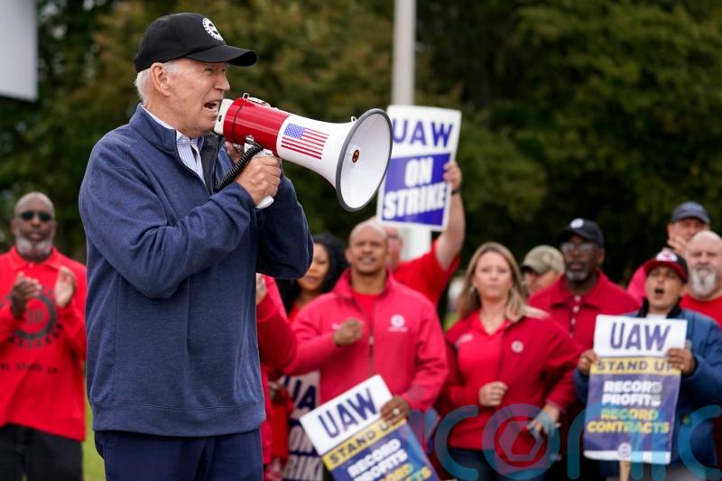 Biden visits car workers’ picket line in Michigan as strike continues
